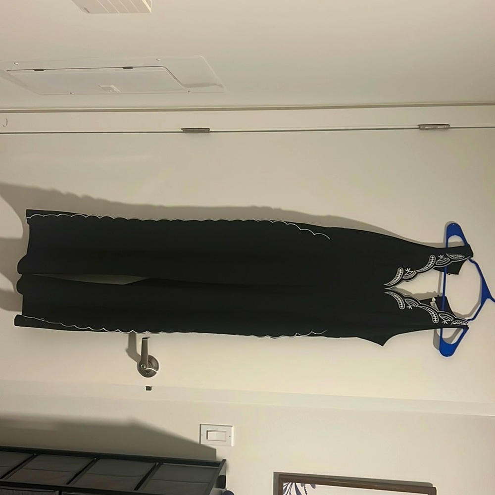 Available by Angela Fashion, sized Medium in Black.